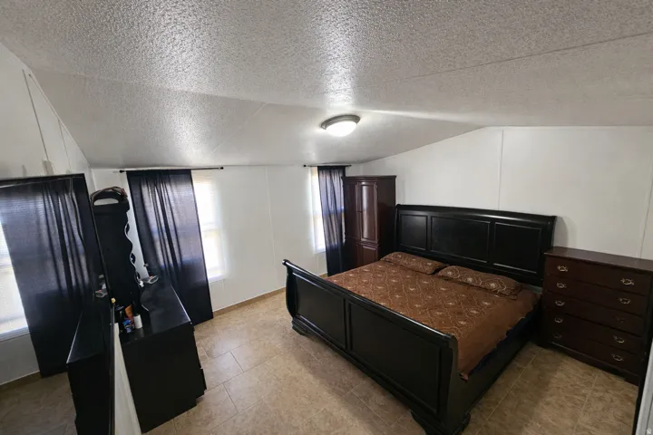 Bedroom featuring light tile patterned flooring