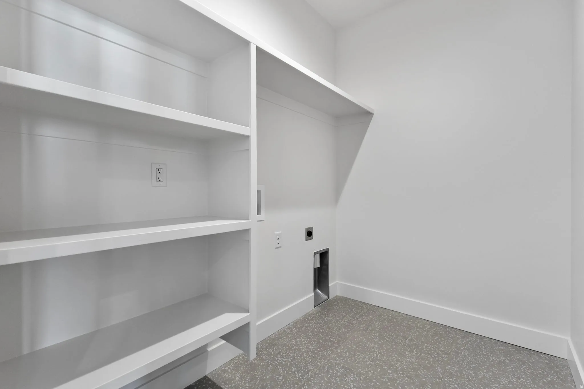 Laundry room with hookup for a washing machine and hookup for an electric dryer