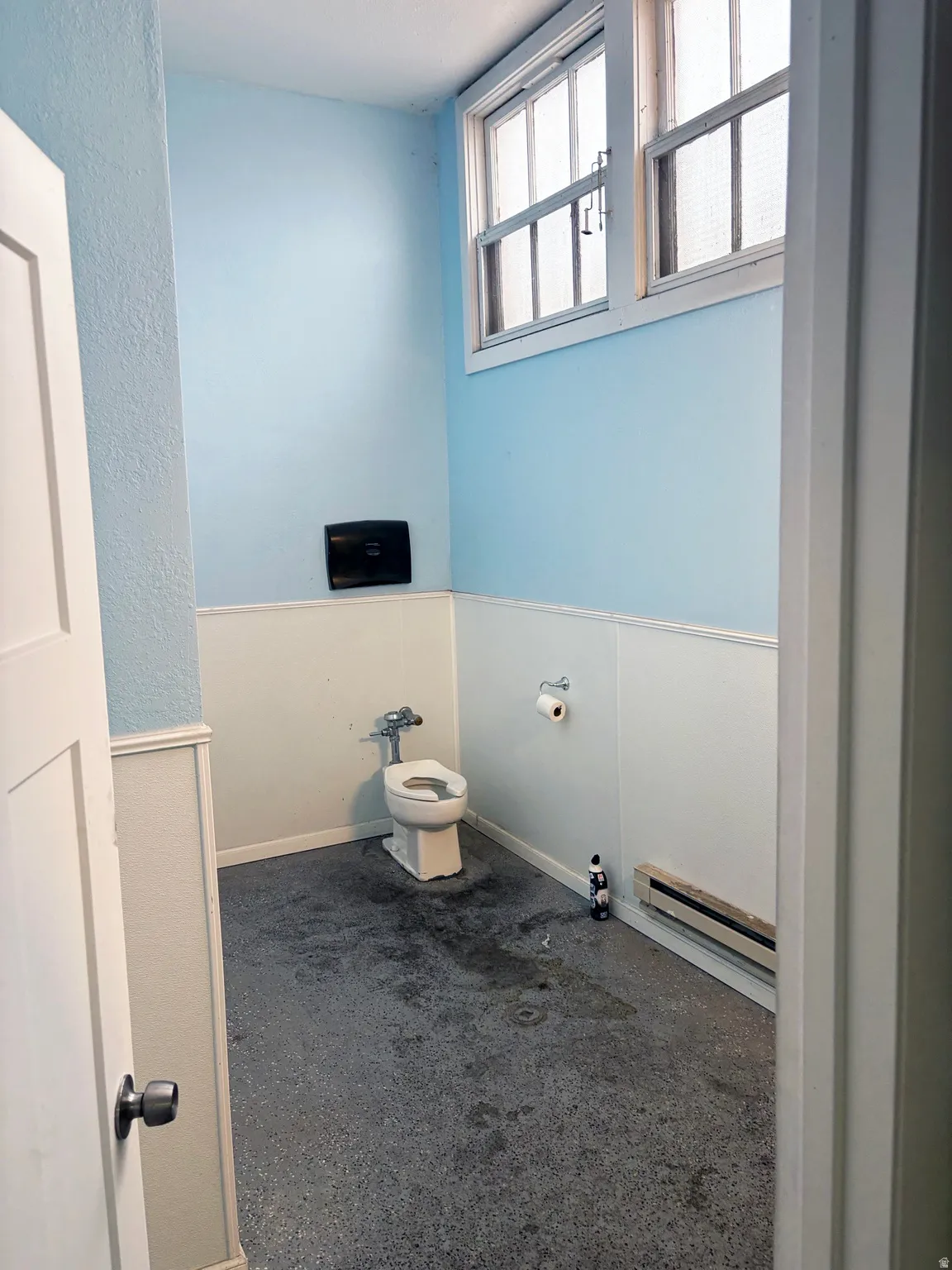 Bathroom featuring carpet flooring and baseboard heating