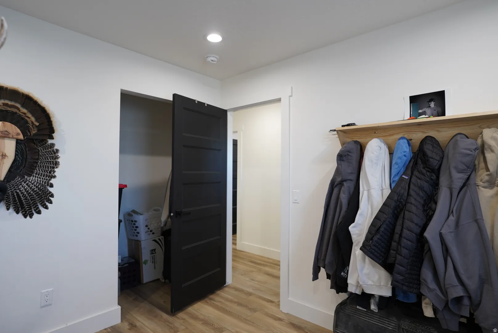 Bedroom with light wood-type flooring and recessed lighting
