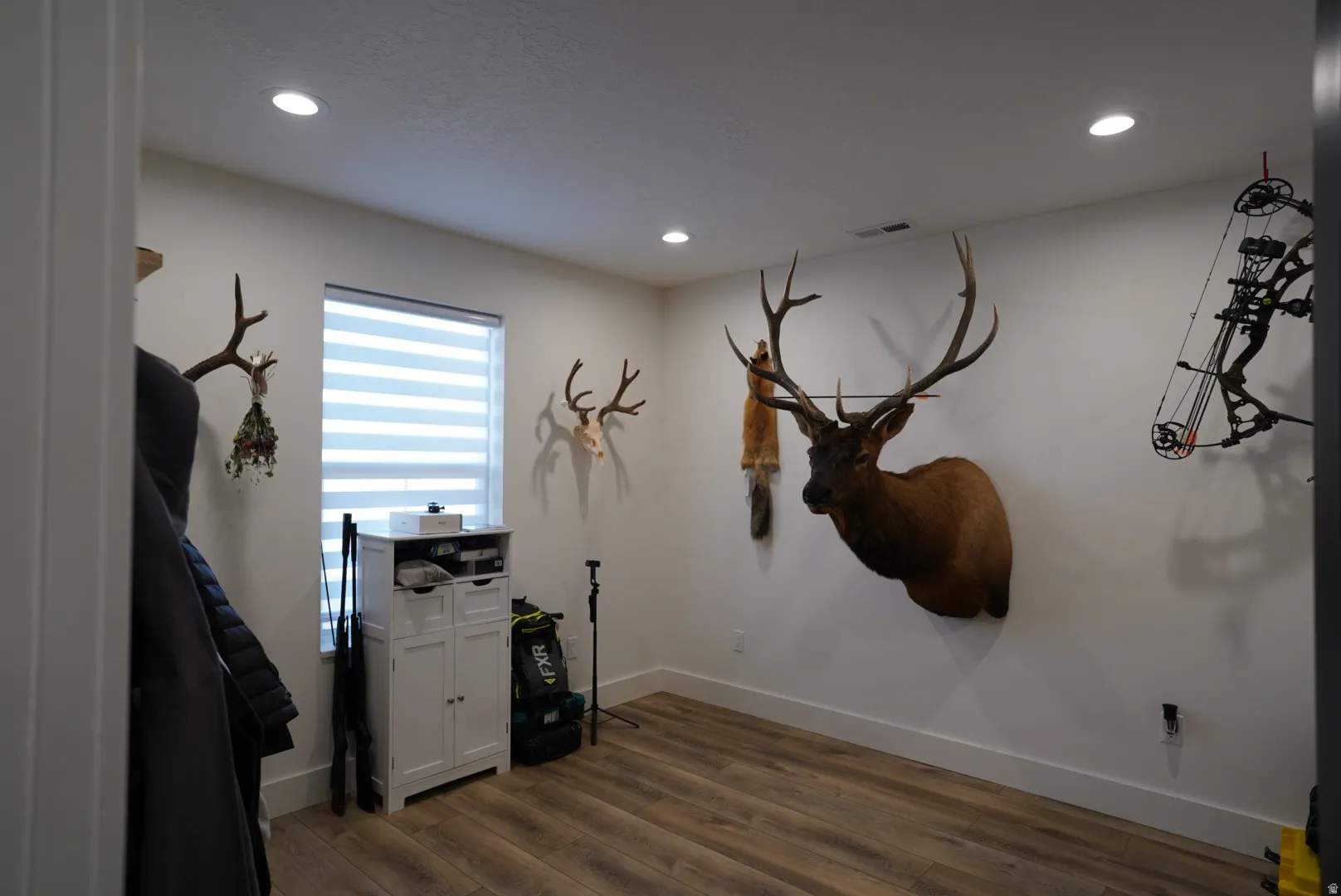 Misc room featuring dark wood finished floors and recessed lighting