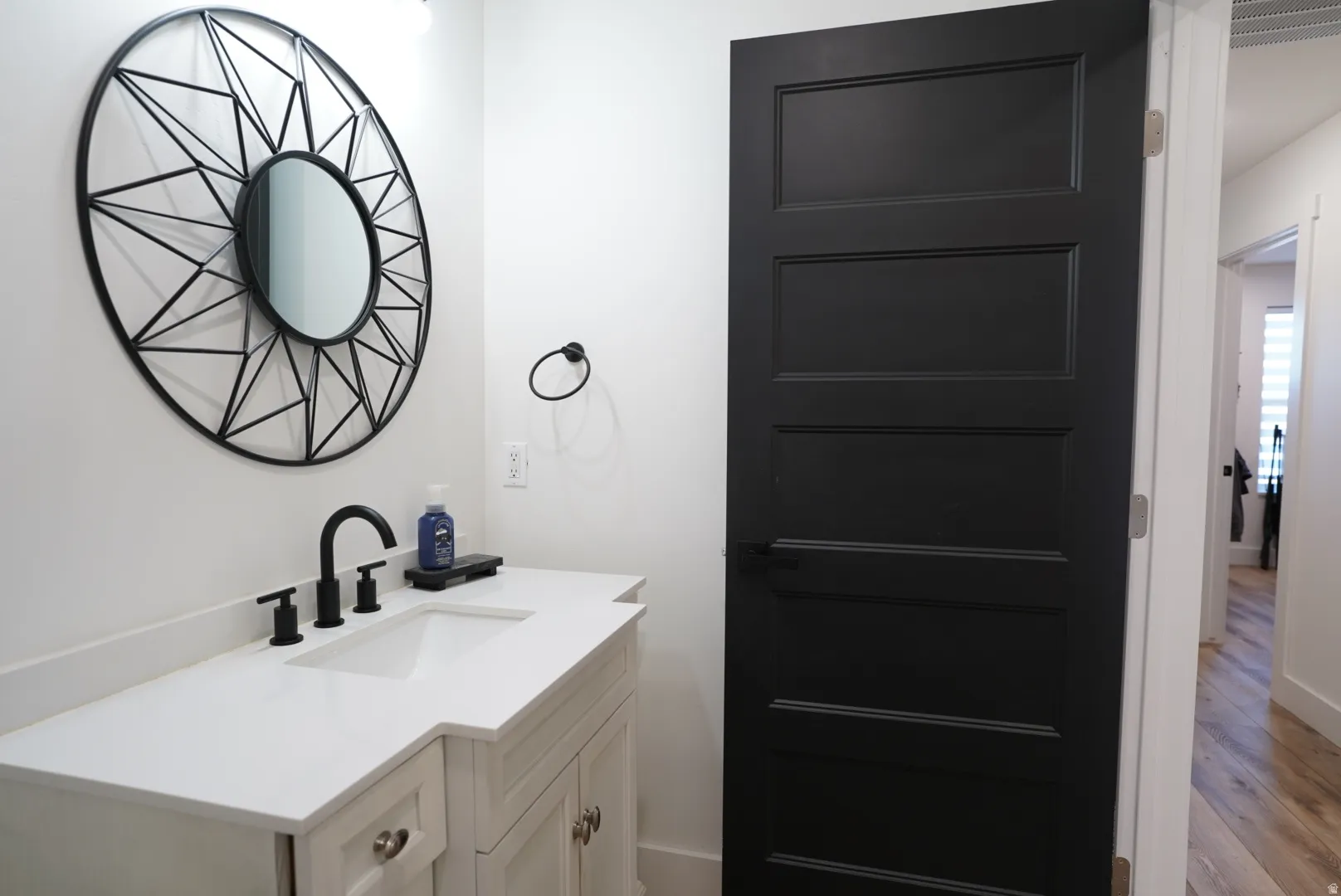 Bathroom with vanity and wood finished floors