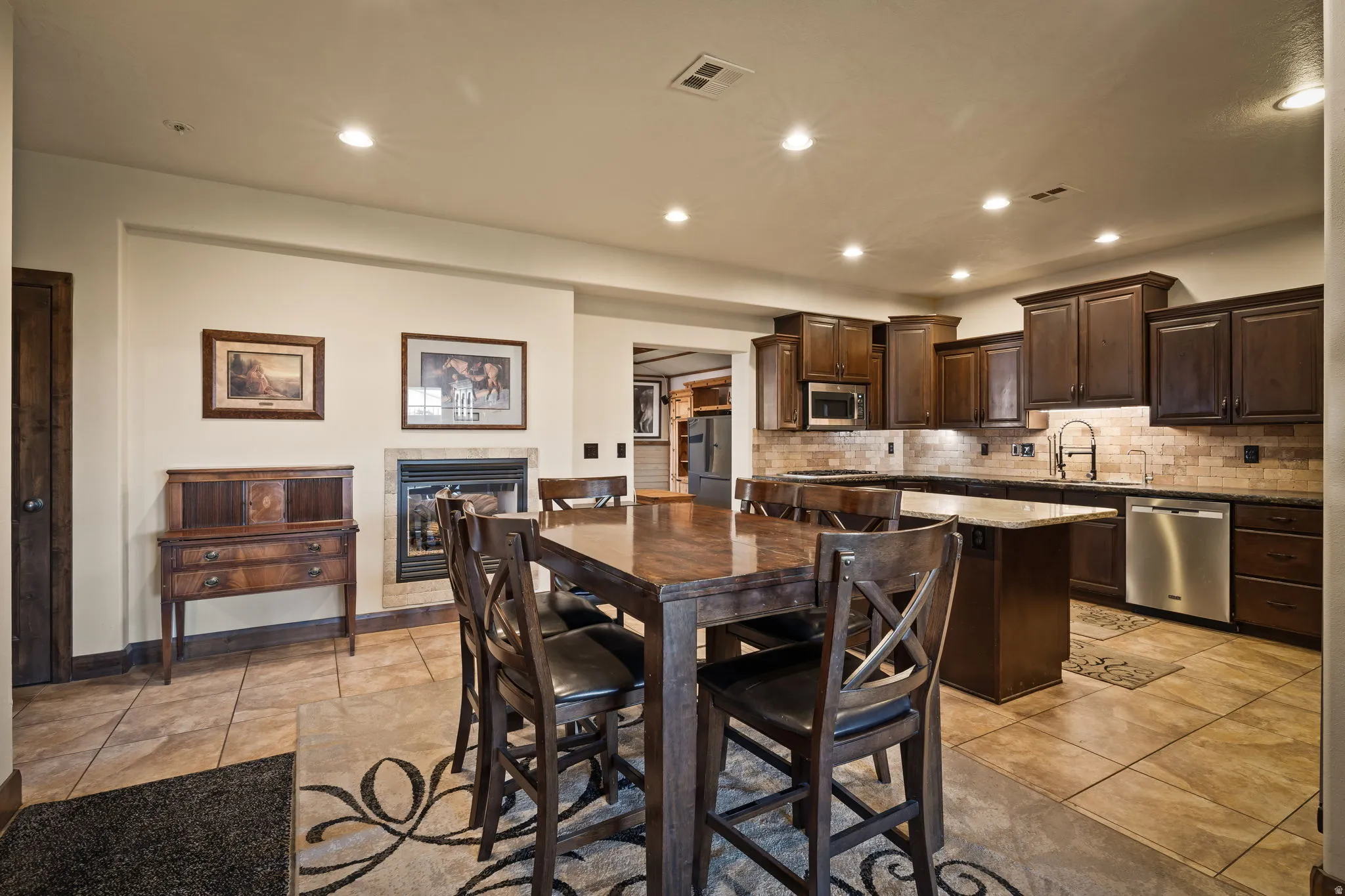 Dining space with recessed lighting and light tile patterned flooring