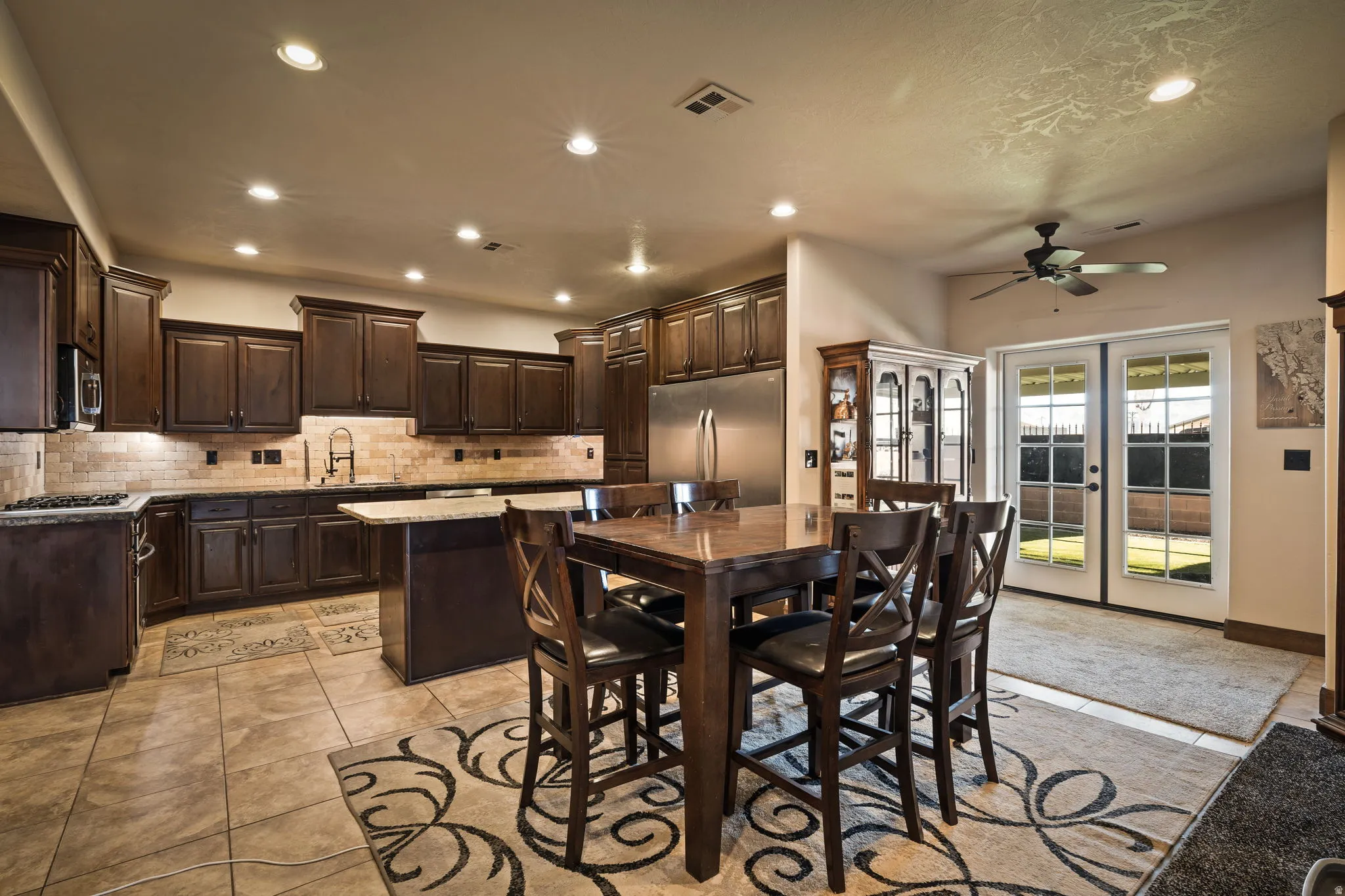 Dining room with recessed lighting and ceiling fan