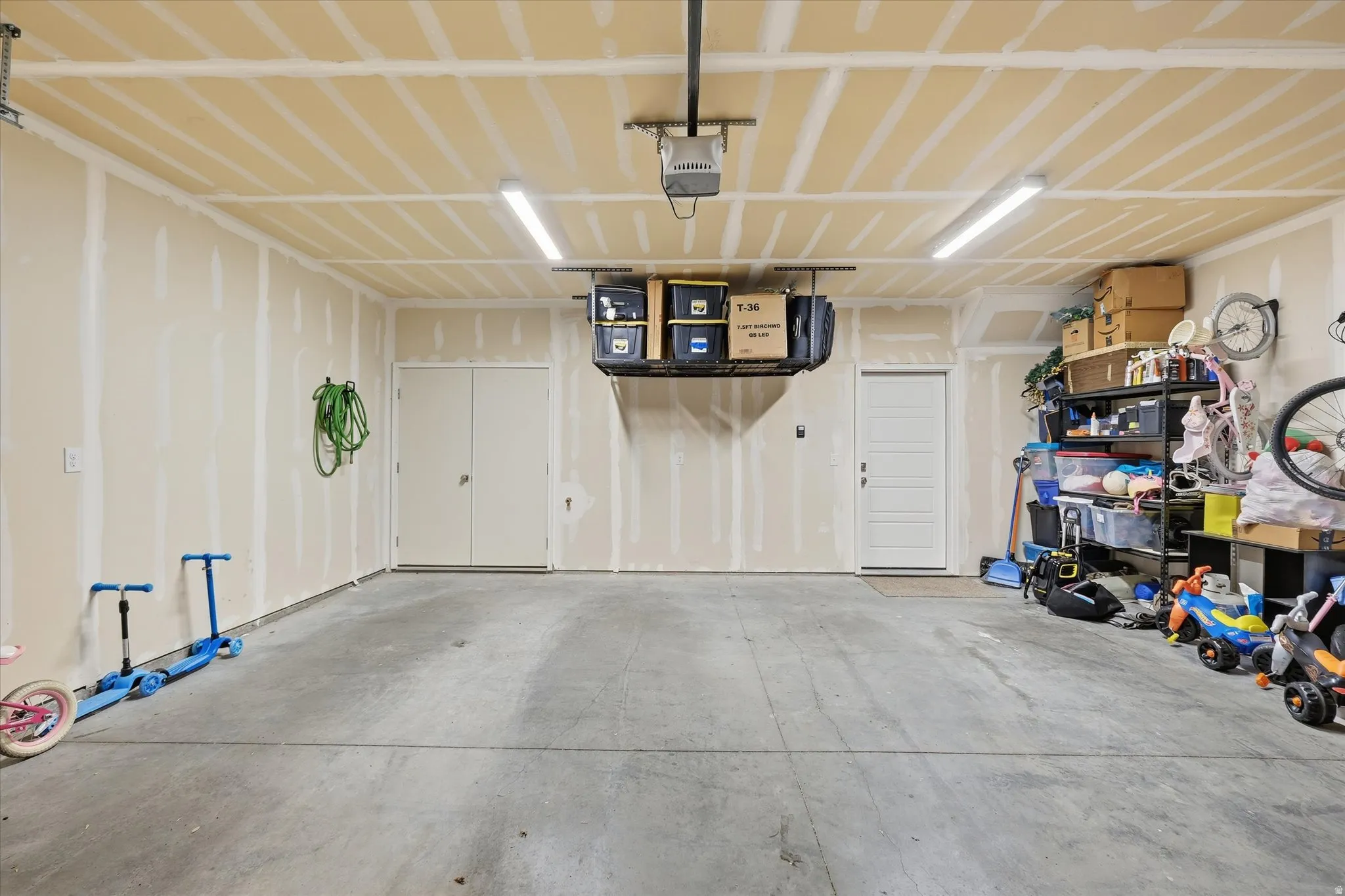 Garage featuring a garage door opener