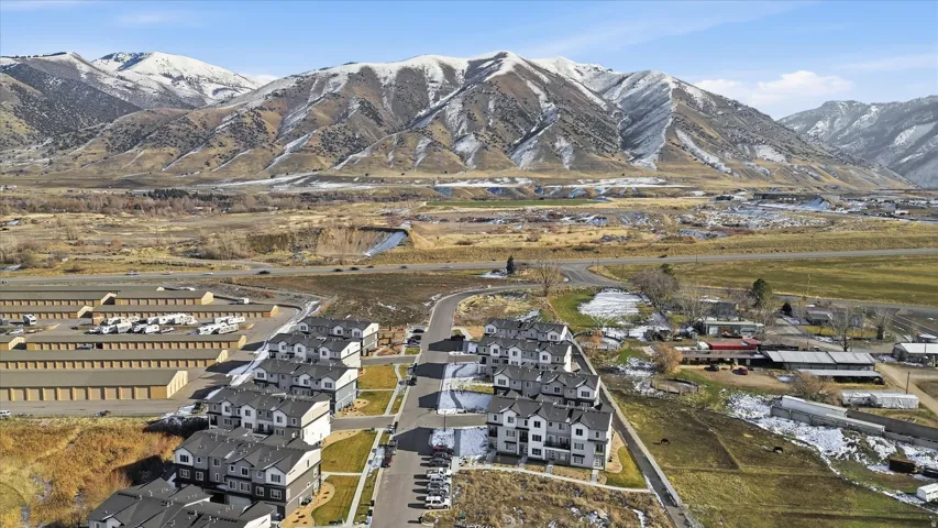 View of property location featuring nearby suburban area and a mountainous background