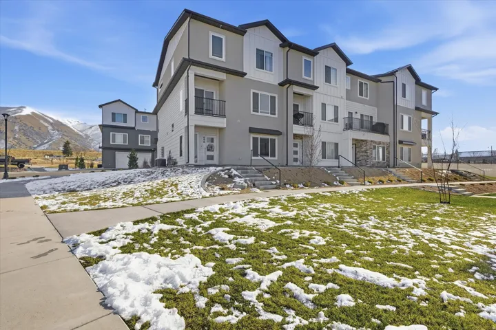 View of front of house featuring a mountain view and stucco siding