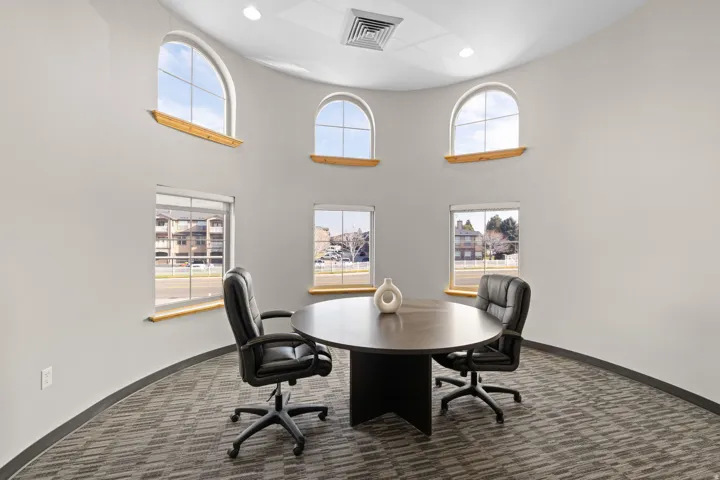 Office featuring recessed lighting and a high ceiling