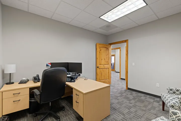 Office space with a paneled ceiling