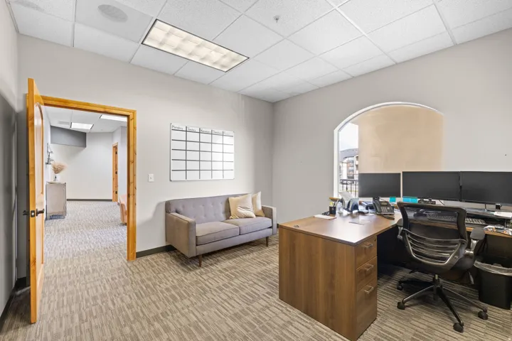 Office area featuring a paneled ceiling