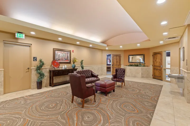 Lobby featuring recessed lighting, wainscoting, and lofted ceiling