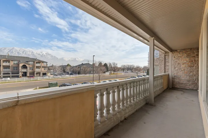 Balcony featuring a mountain view and a residential view