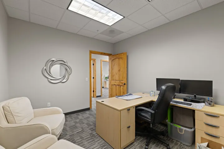 Office space with a paneled ceiling