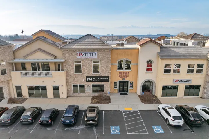 View of commercial location with uncovered parking