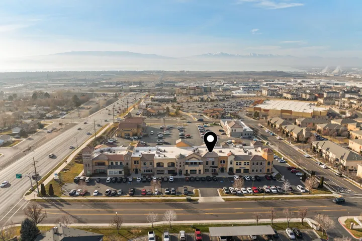 Aerial overview of property's location featuring a mountainous background