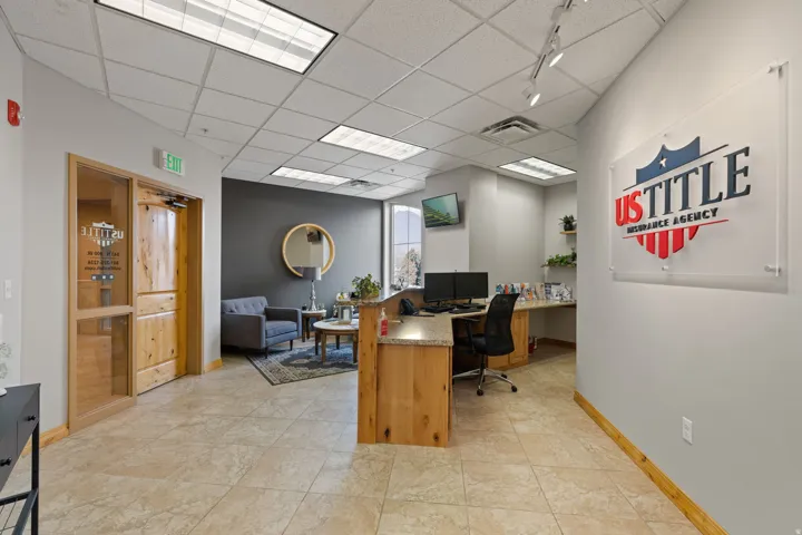 Office area with a paneled ceiling and built in study area