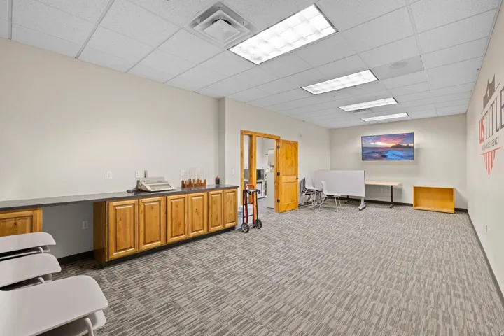 Miscellaneous room with an office area and a drop ceiling