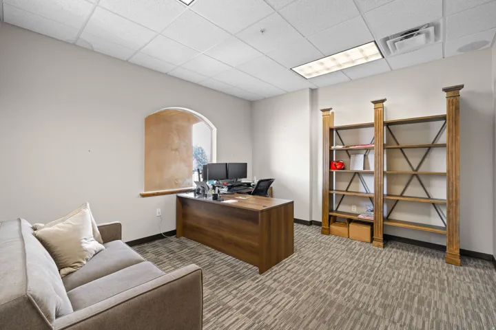 Office area with a paneled ceiling