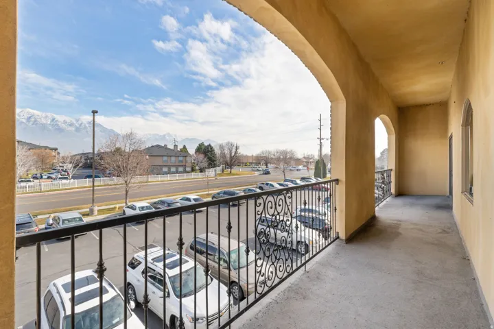 Balcony featuring a mountain view and a residential view