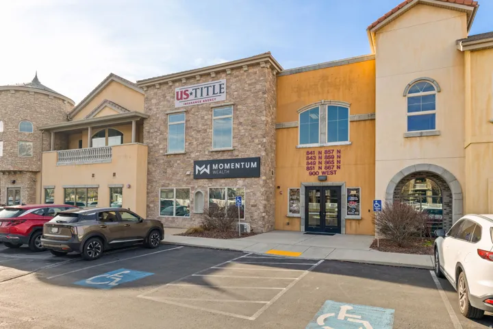 View of commercial location featuring uncovered parking