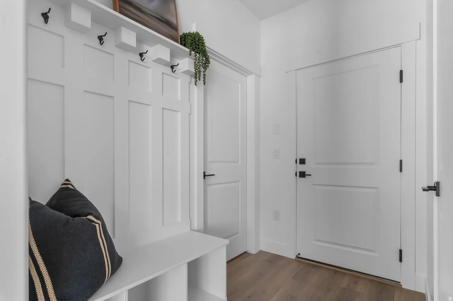 Mudroom featuring dark wood-type flooring