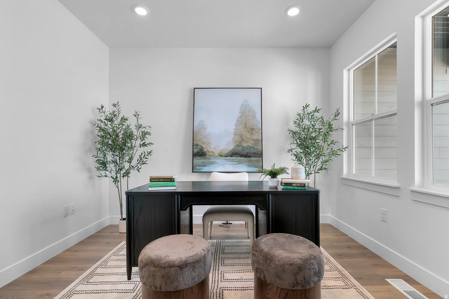 Office space featuring wood finished floors and recessed lighting