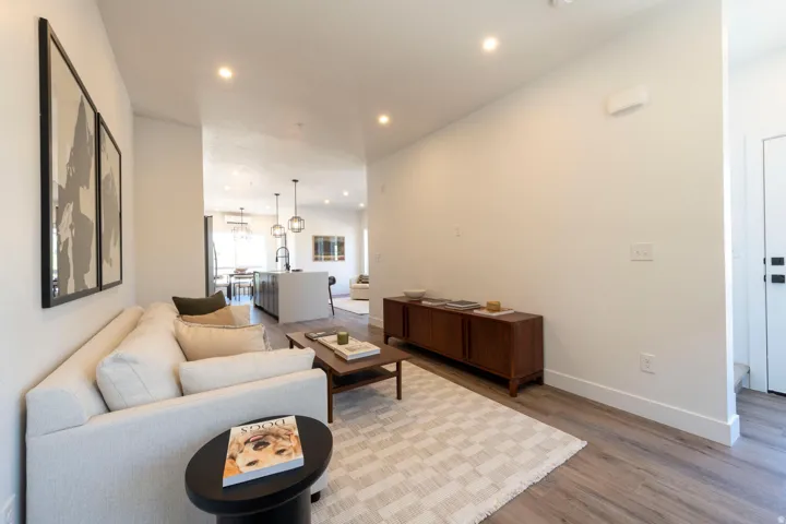 Living area featuring wood finished floors and recessed lighting