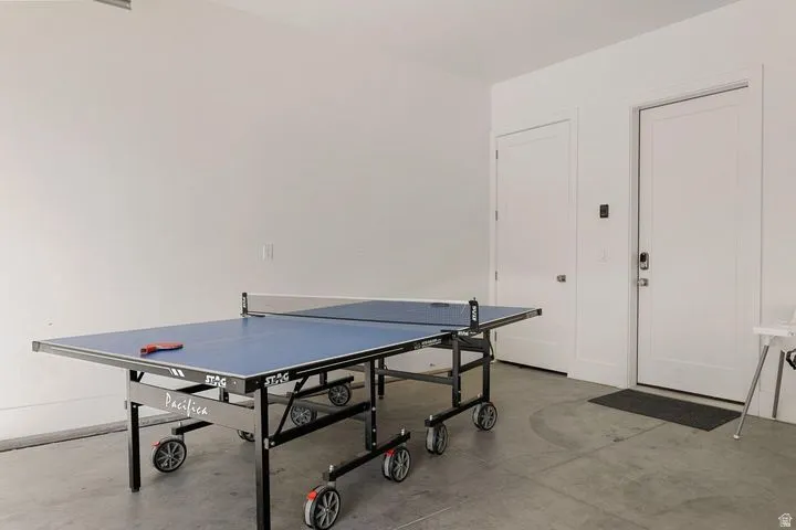 Game room featuring concrete floors