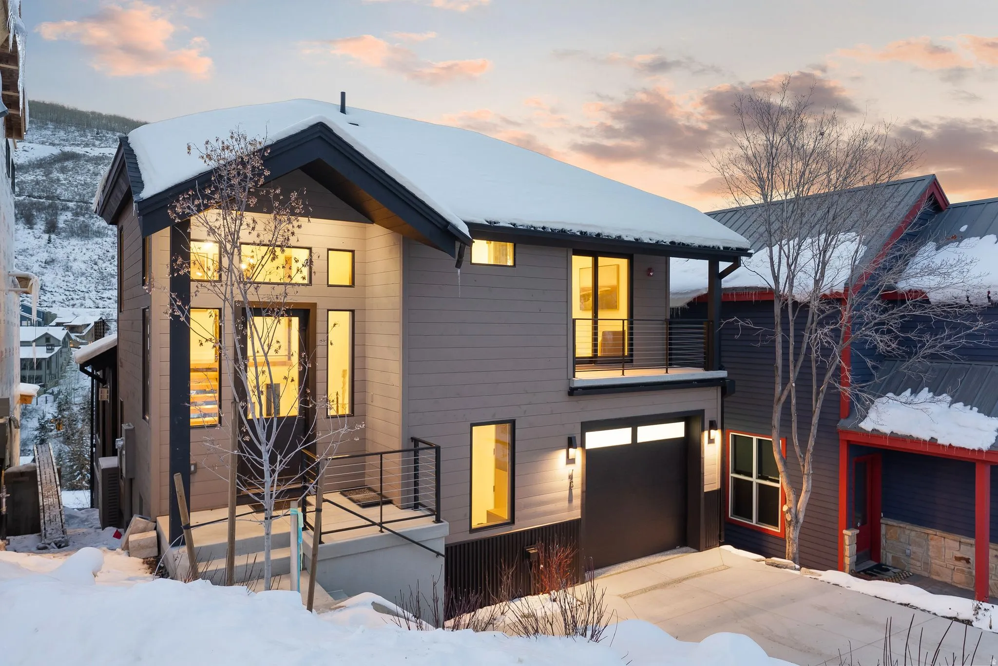 Contemporary home with a garage and a balcony