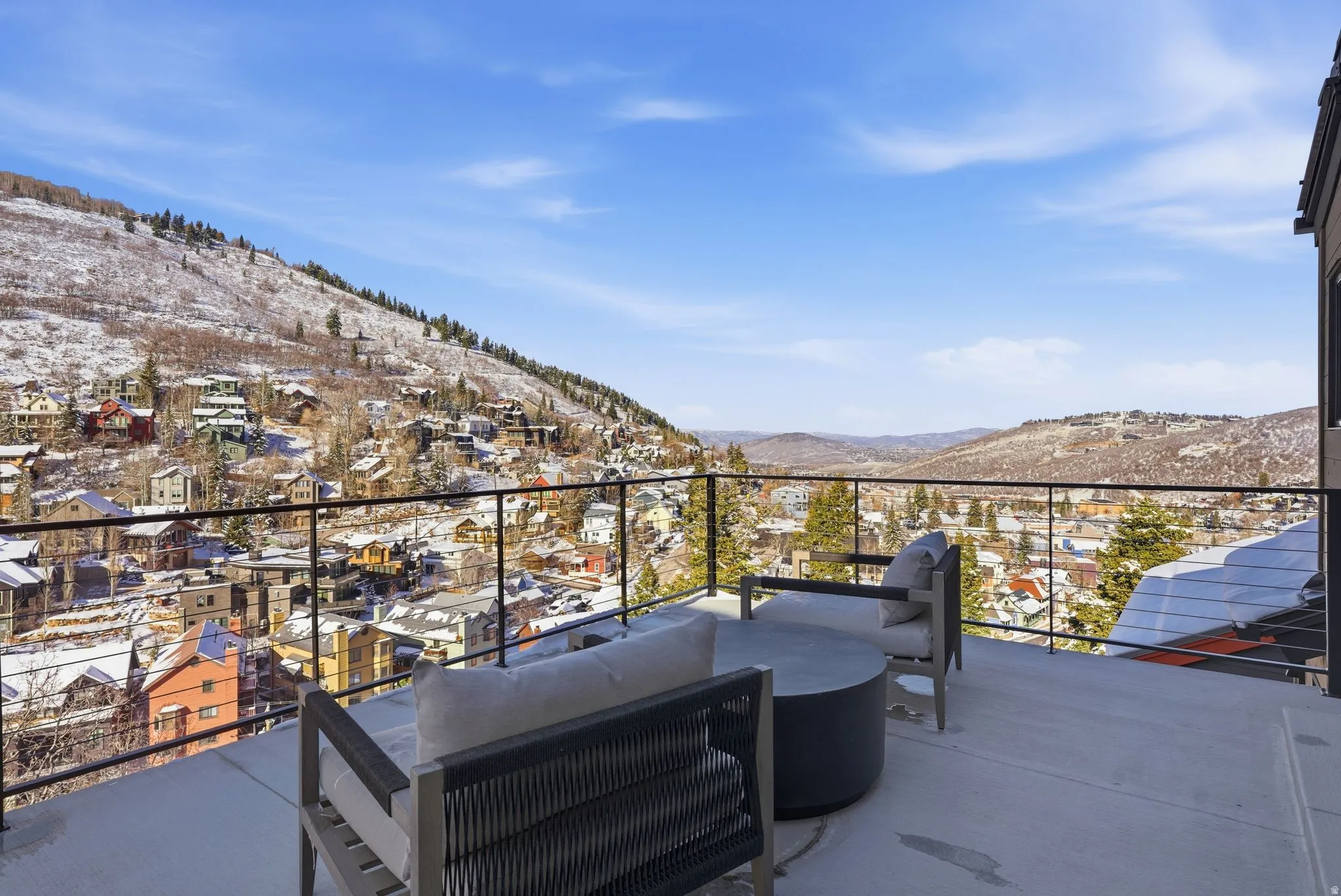 Balcony with a mountain view, a residential view, and an outdoor living space