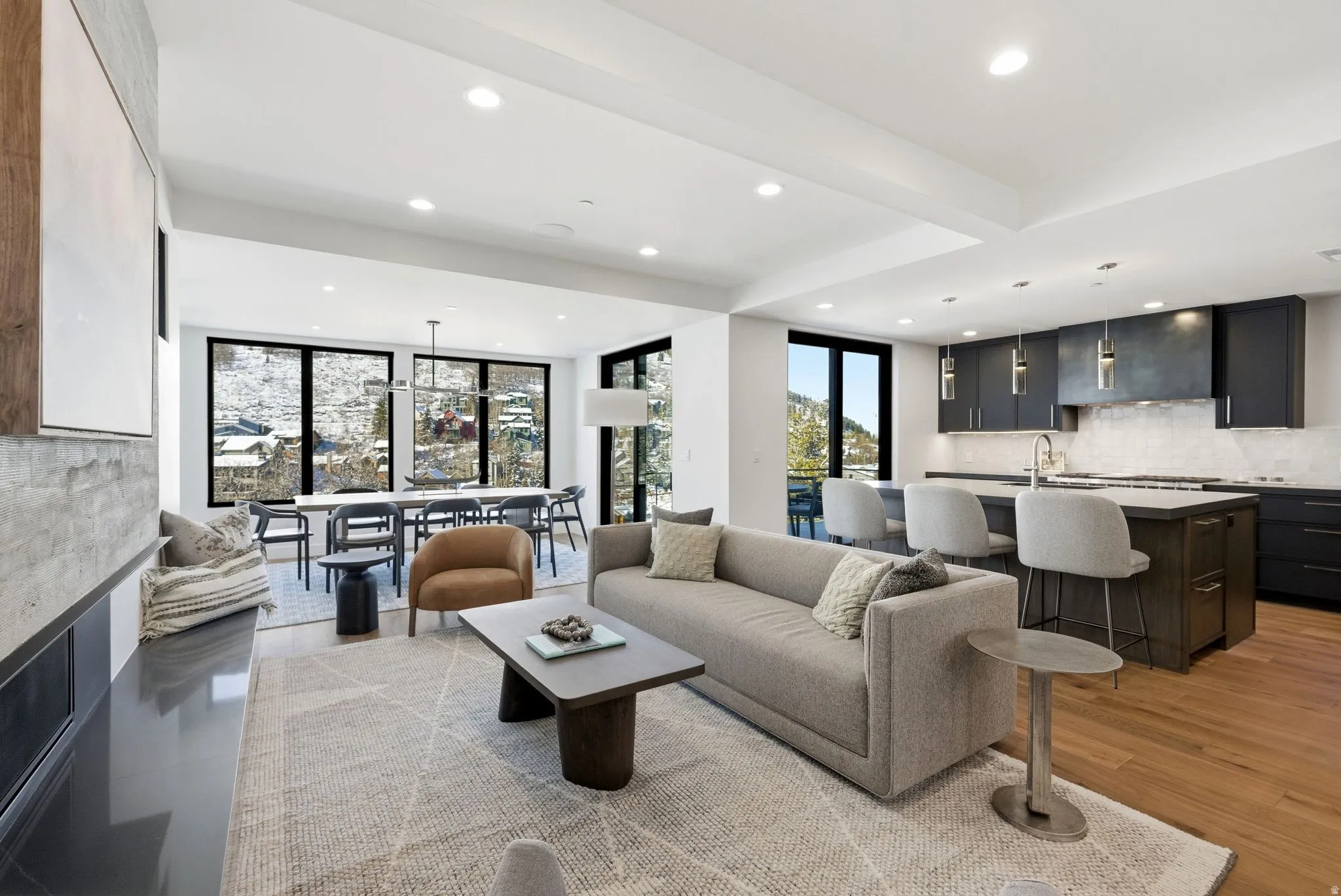 Living area featuring recessed lighting, light wood-style floors, and a fireplace