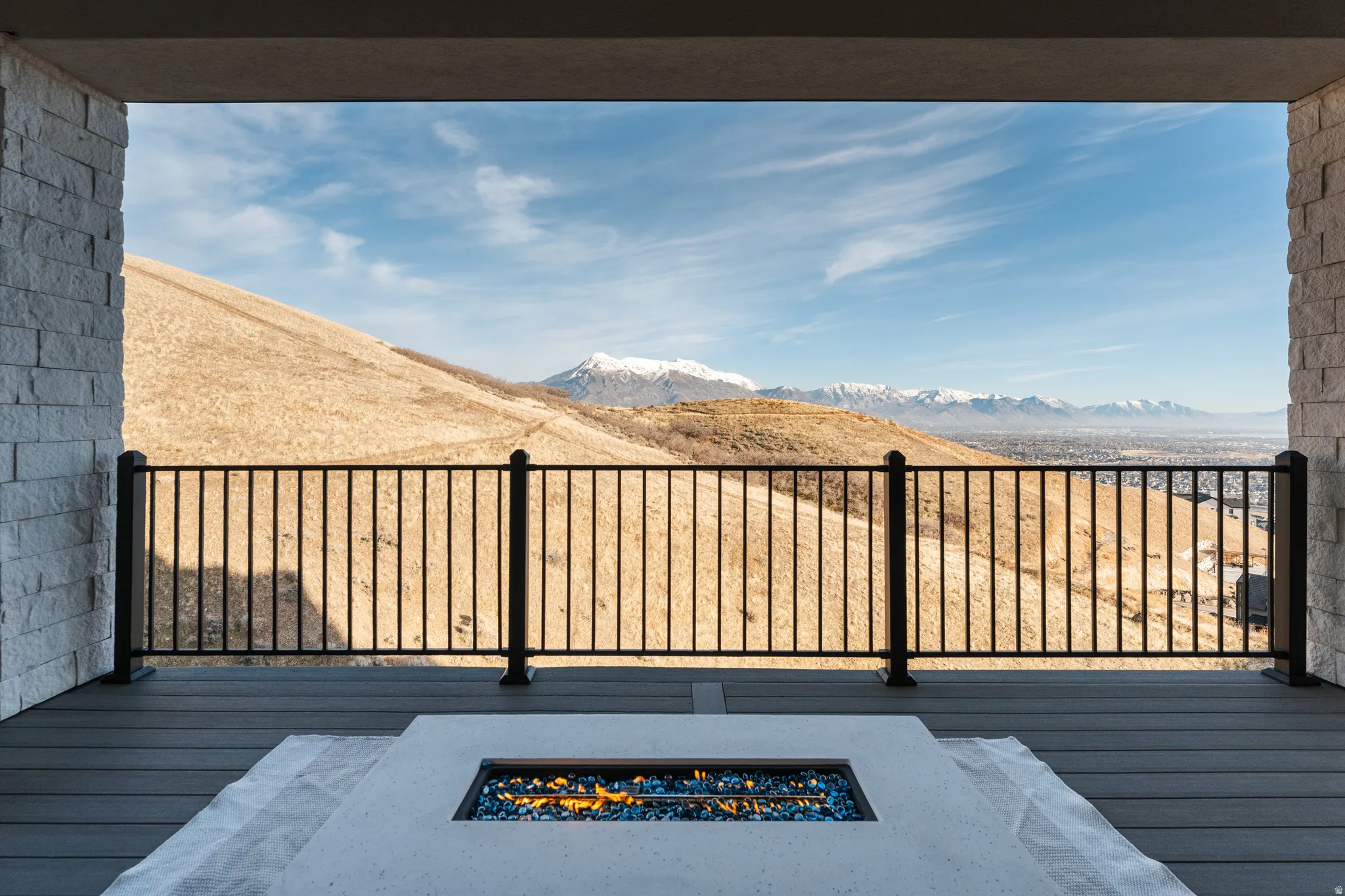 Deck featuring an outdoor fire pit and a mountain view
