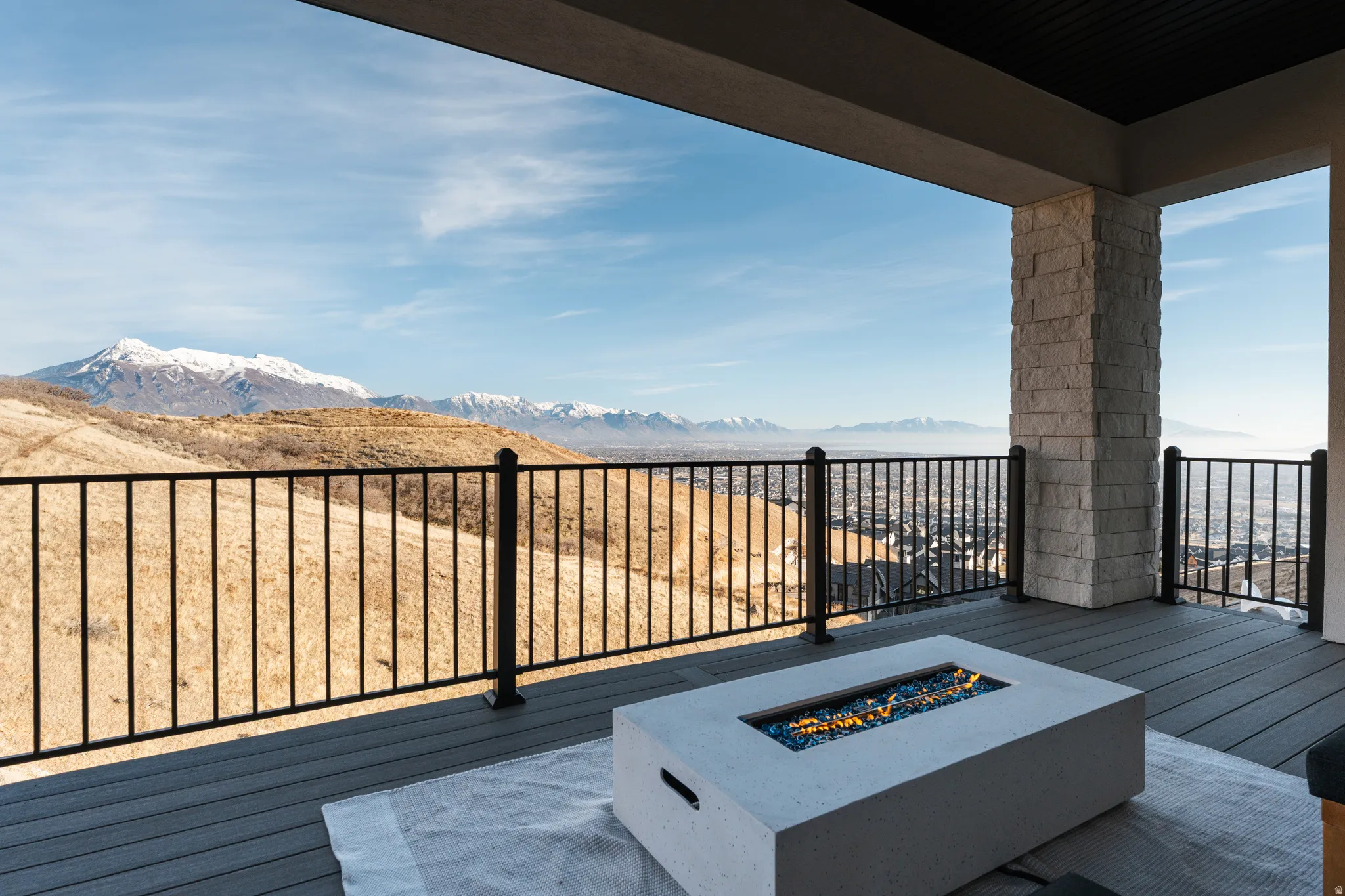 Deck featuring a fire pit and a mountain view