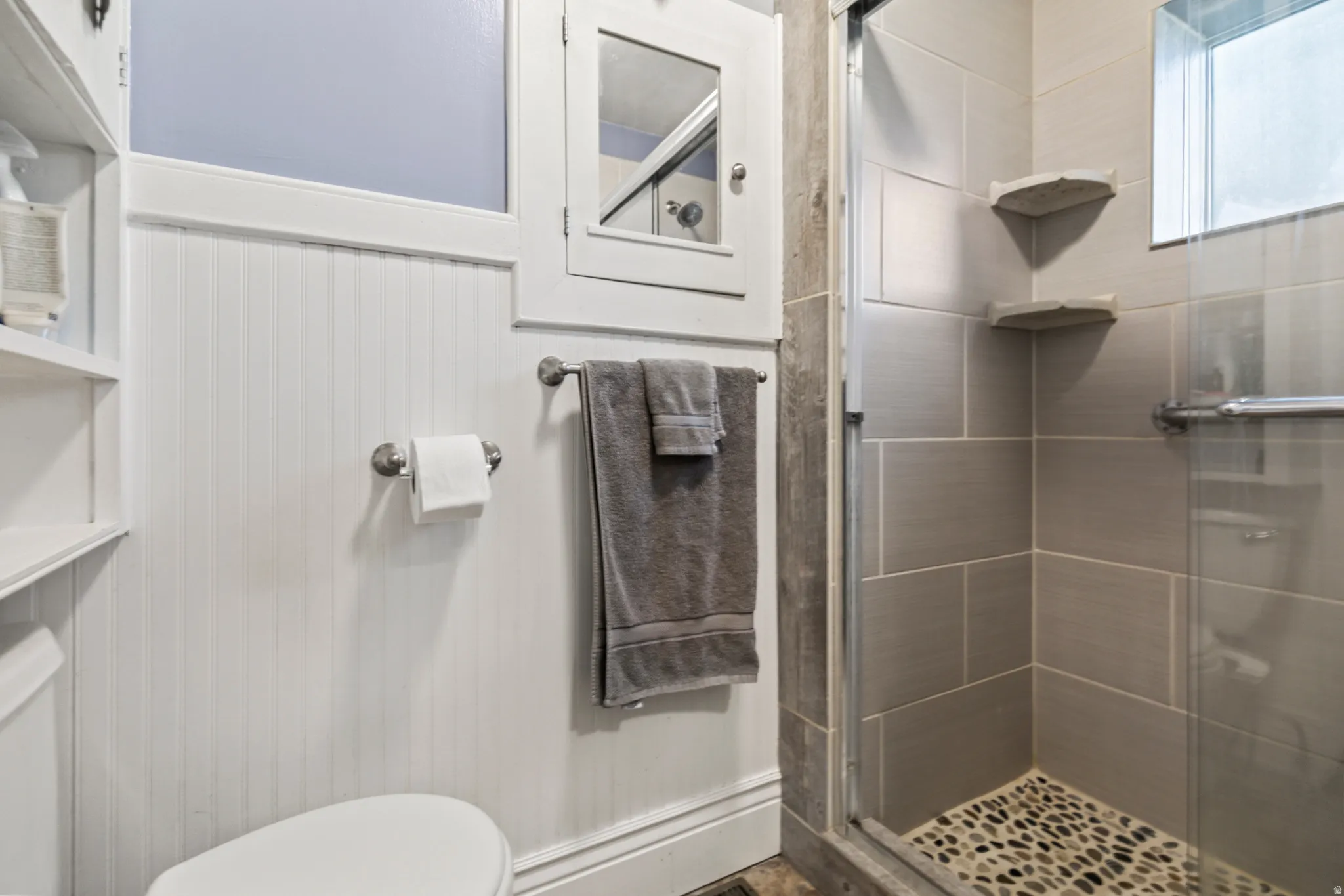 Full bath with a shower stall