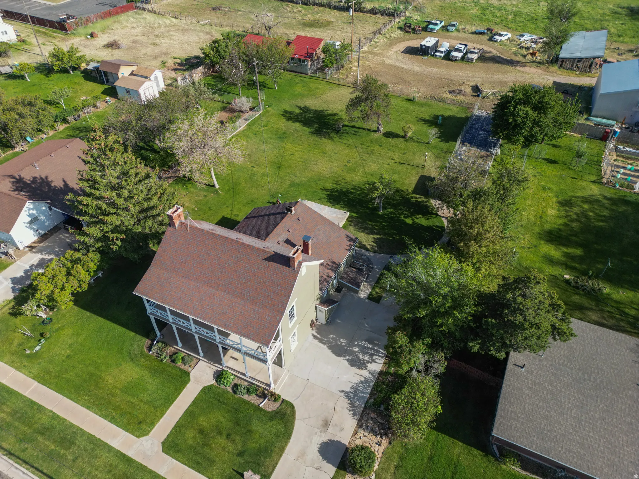 Two-story traditional residence with a covered porch and balcony