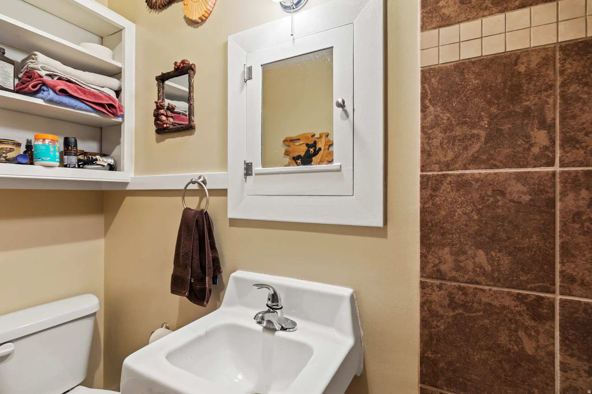 Half bathroom with a sink and toilet