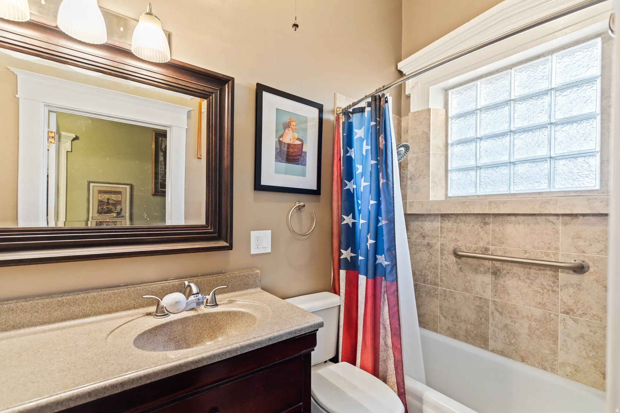 Full bathroom featuring vanity and shower / tub combo