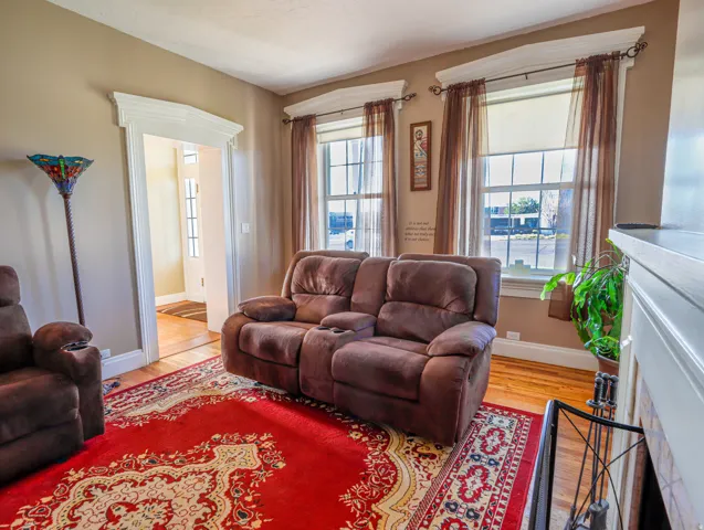Living area featuring wood-finish flooring and neutral wall tones