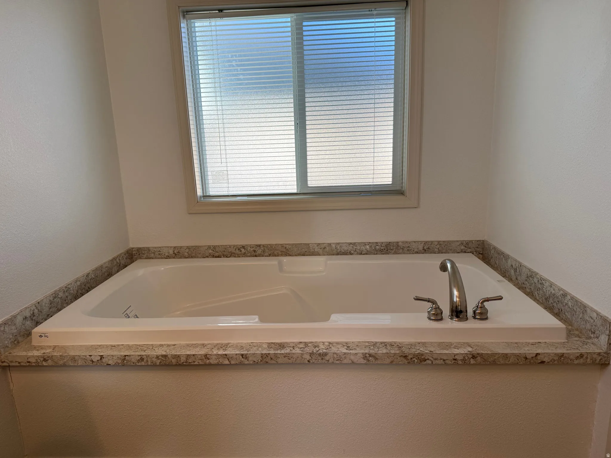 Full bathroom featuring a bath