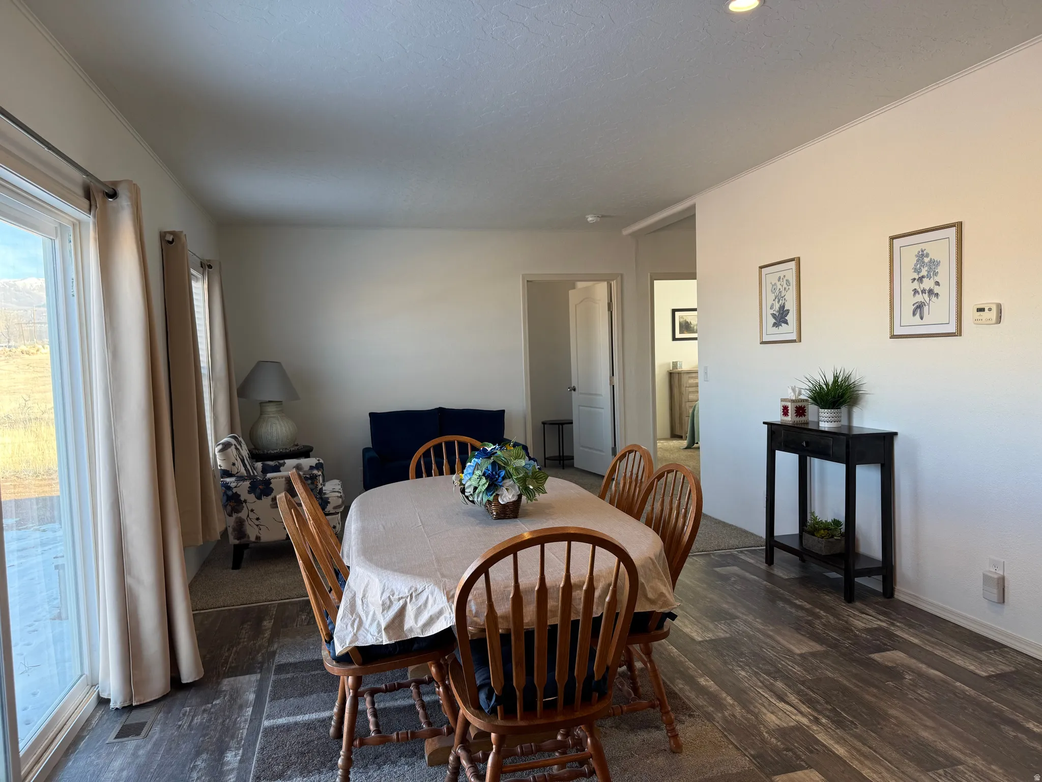 Dining room with dark wood-style floors
