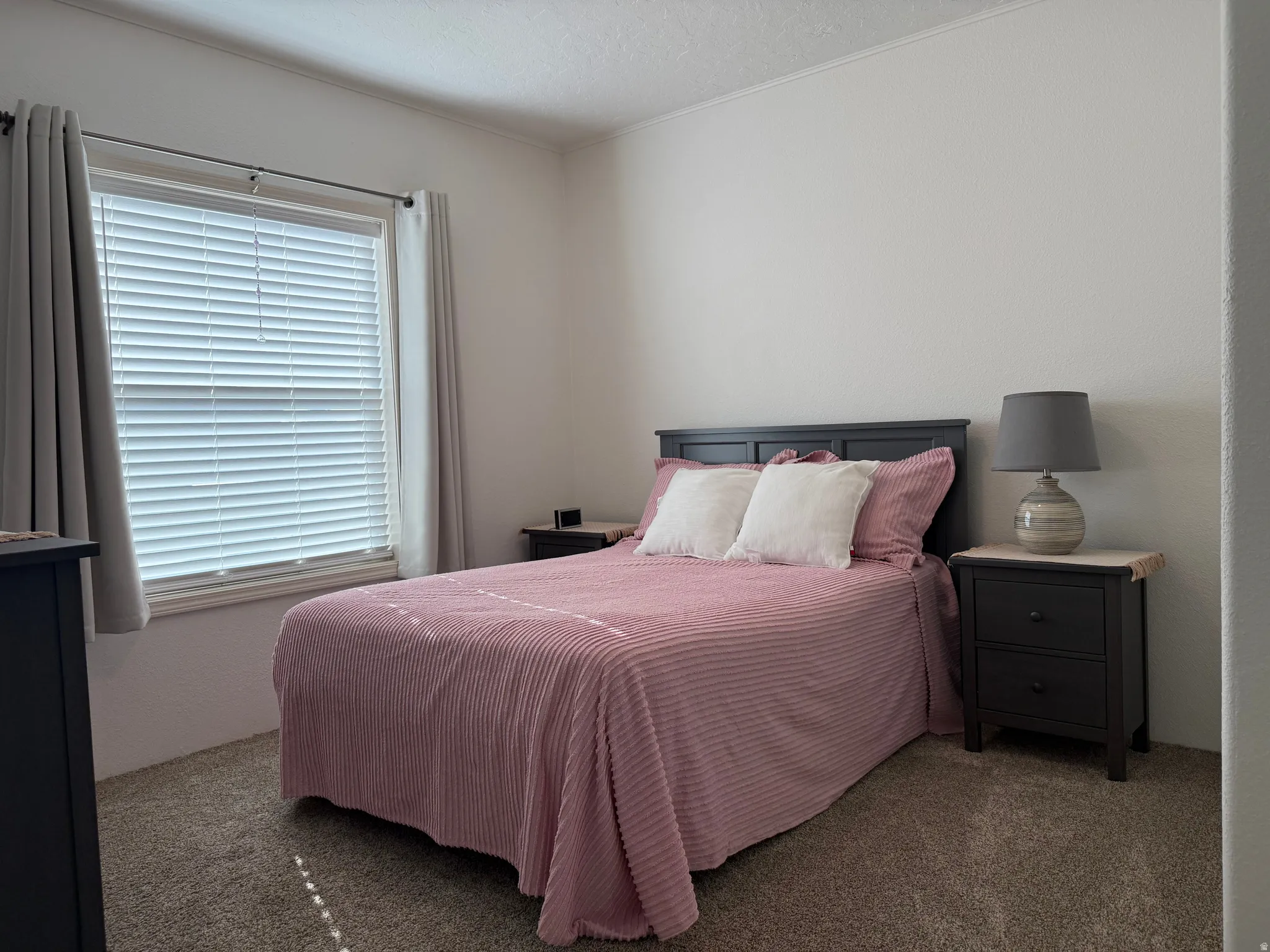 View of carpeted bedroom