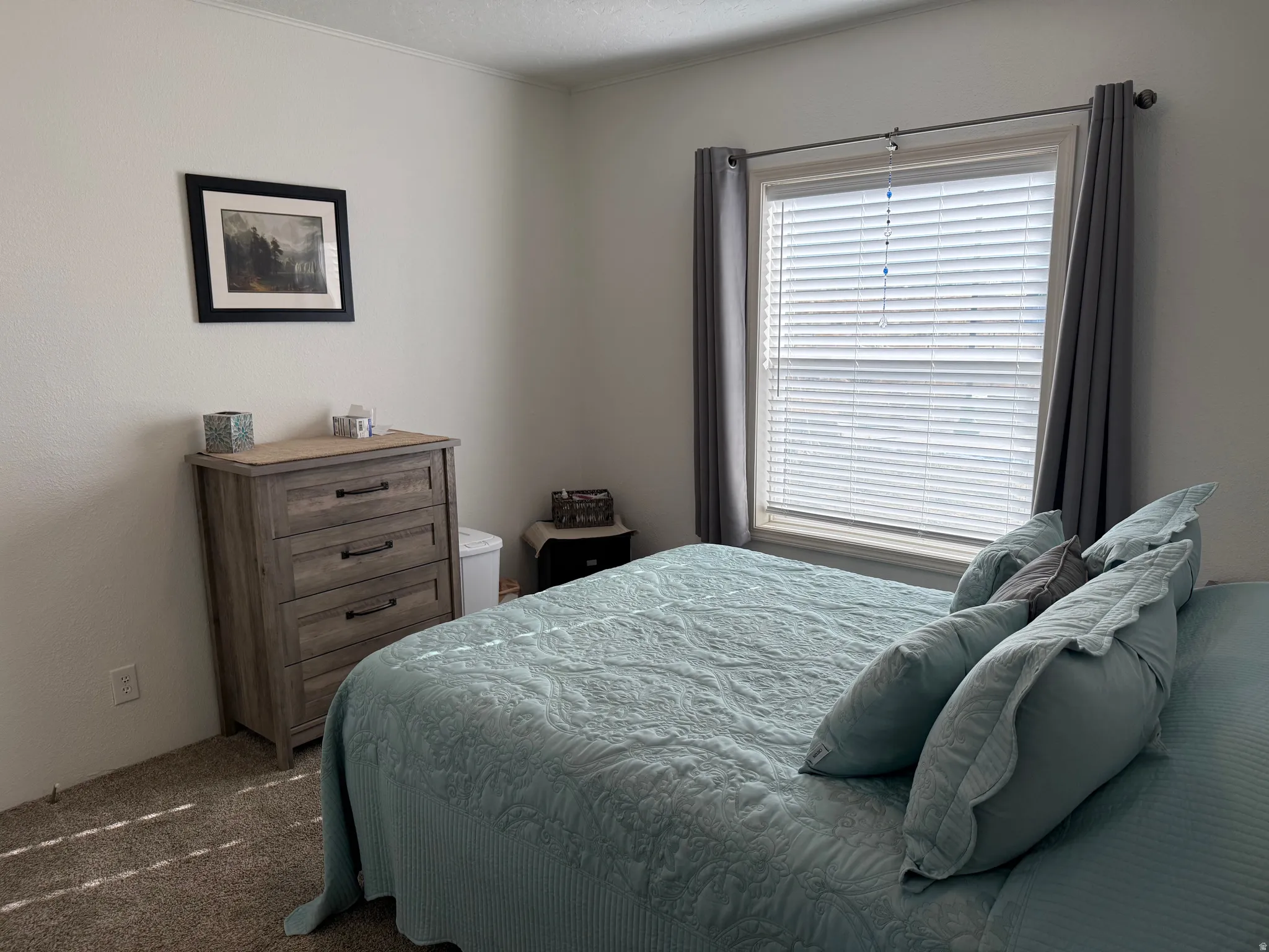 Bedroom featuring carpet and ornamental molding