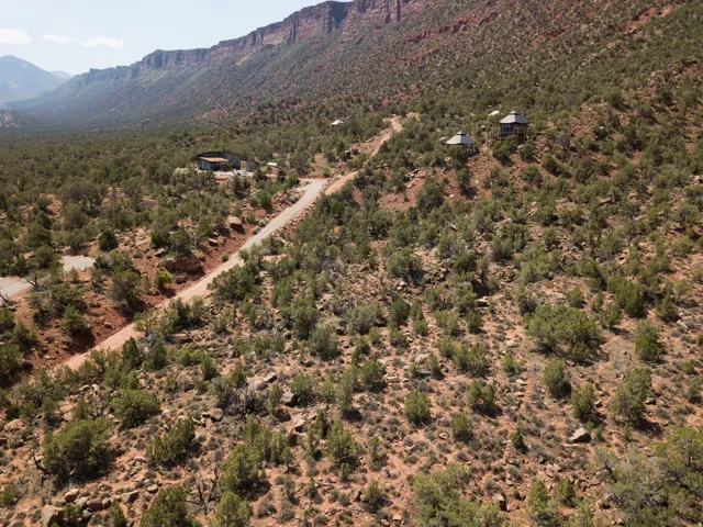 Aerial overview of property's location with a mountainous background