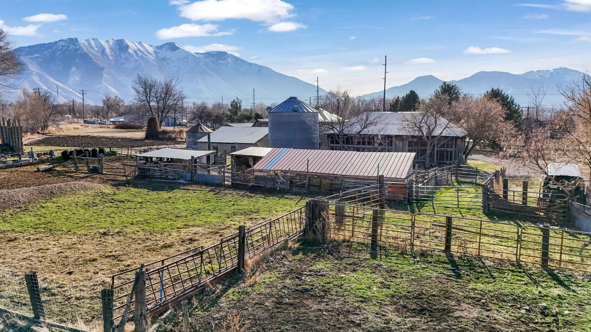 View of yard featuring a mountain view, an outbuilding, and an exterior structure