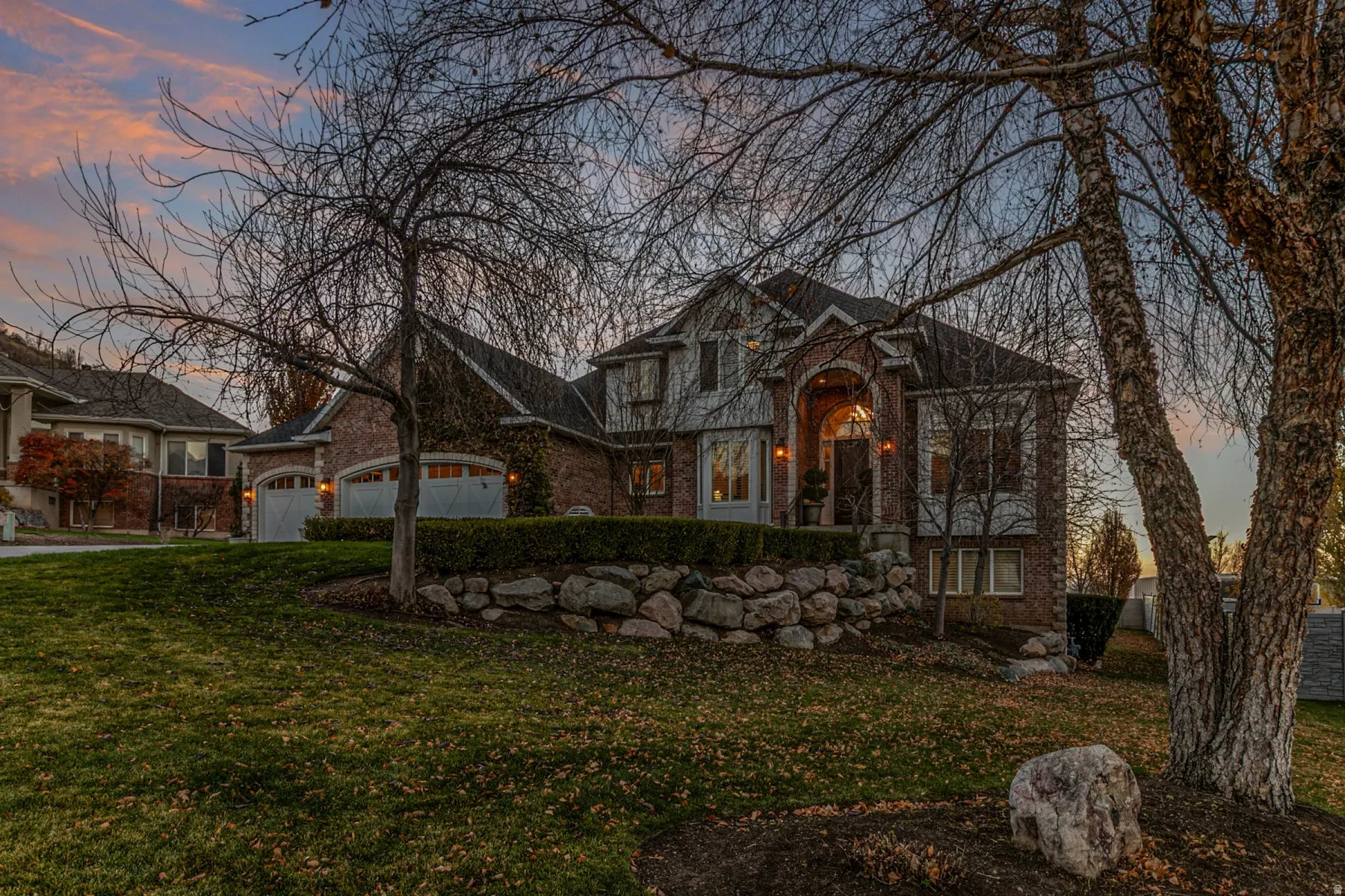 Home sits back off the street with mature trees and large front yard.