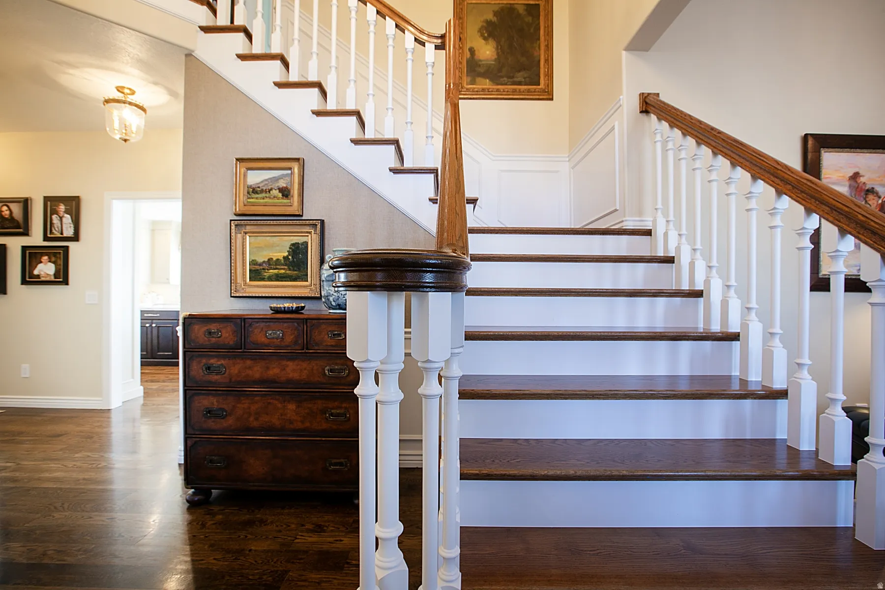 Stairway featuring wood finished floors