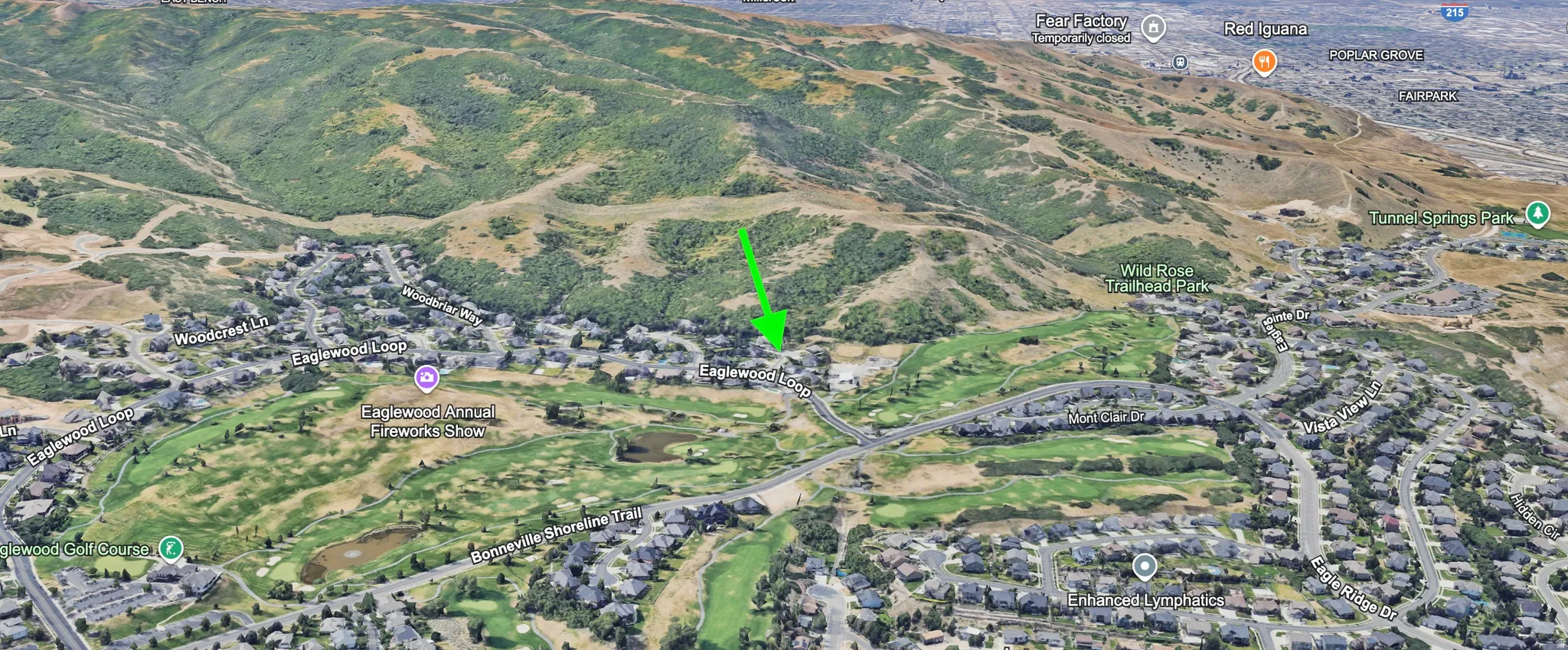 Aerial view of neighboring golf course, mountains and national forest