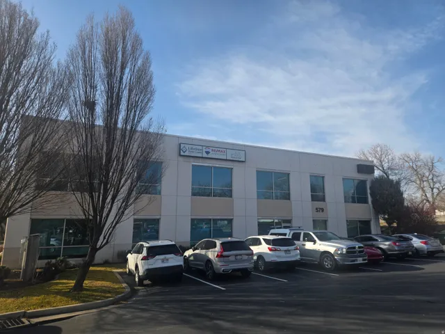 View of commercial location with uncovered parking