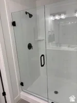 Full bathroom with a stall shower and a sink