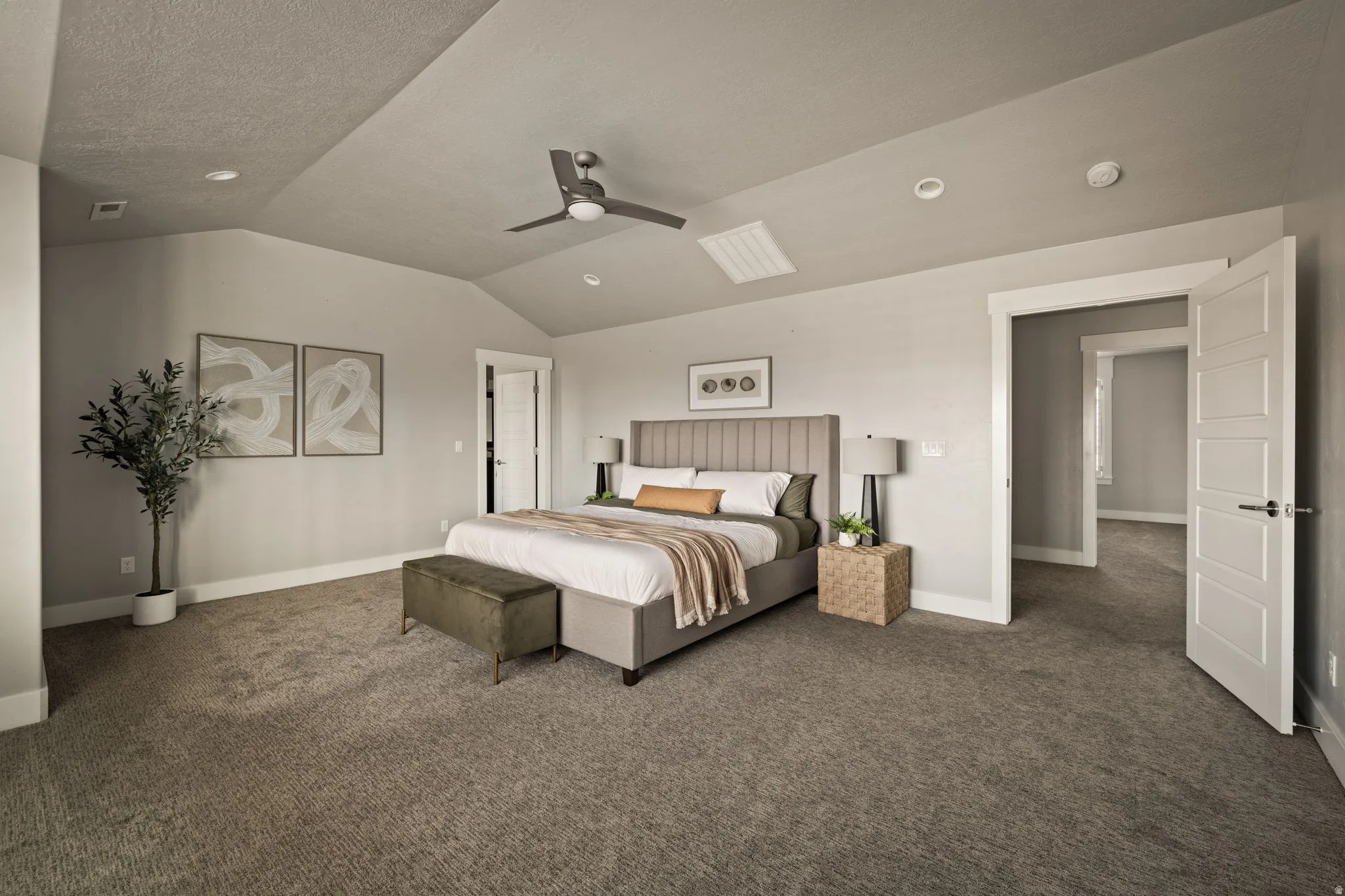 Bedroom featuring dark carpet, vaulted ceiling, ceiling fan, and recessed lighting